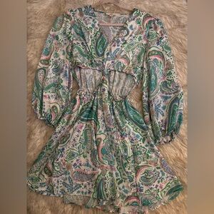 Cute vibrant dress with open sides.